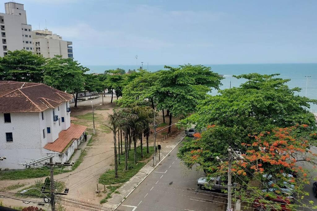 a view of a street in a city with trees at A 60 m da Praia da Areia Preta in Guarapari