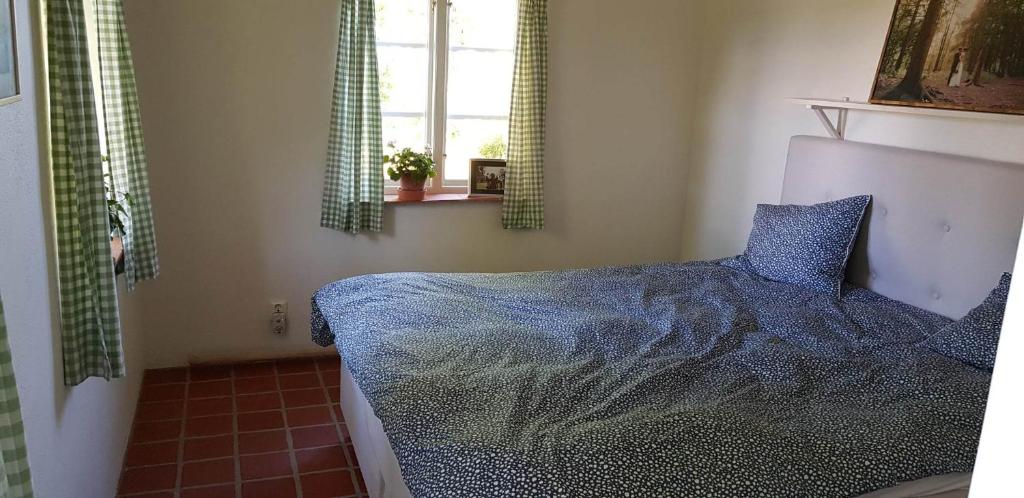 Postel nebo postele na pokoji v ubytování Mölle Vattenmöllan
