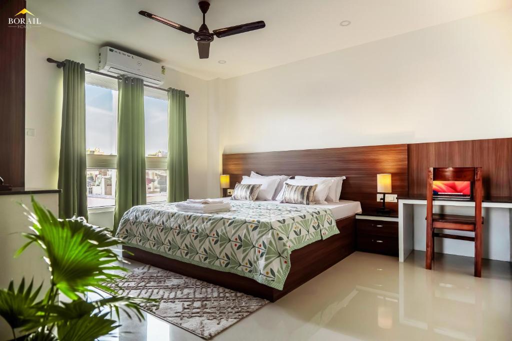 Un pat sau paturi într-o cameră la Borail Homes