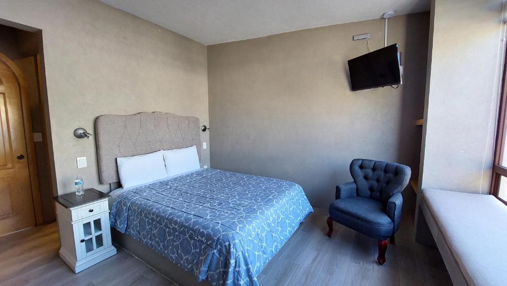 Postel nebo postele na pokoji v ubytování Hotel Casa Caro