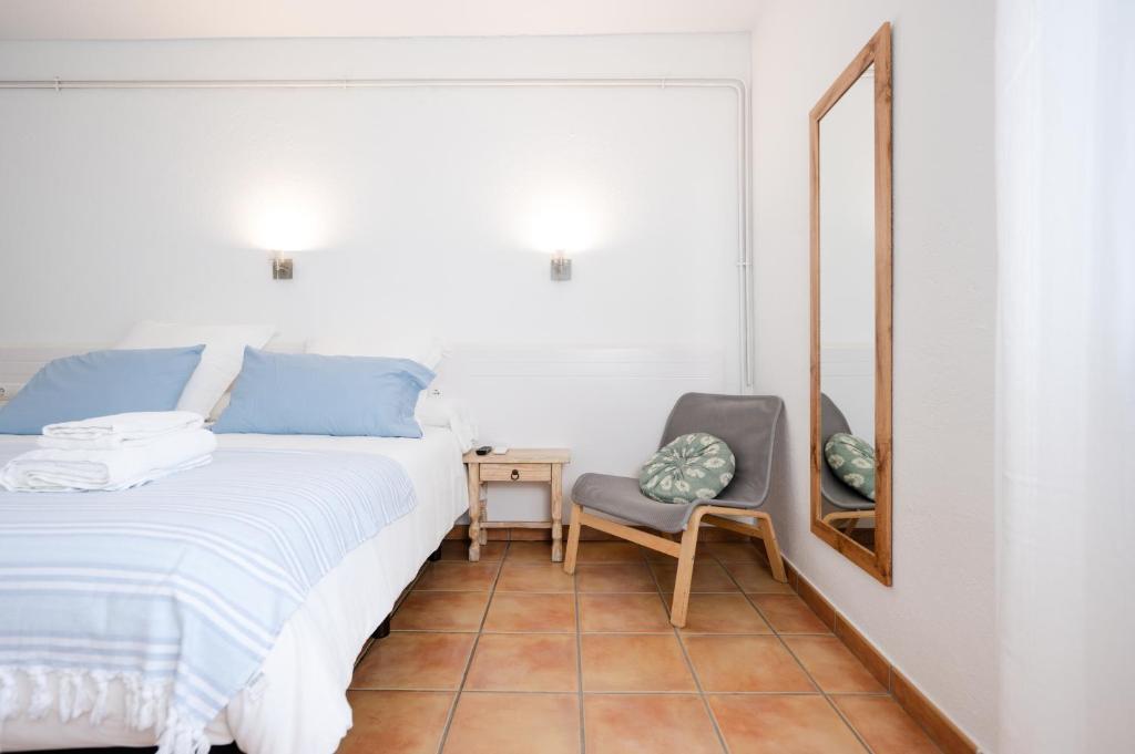 Postel nebo postele na pokoji v ubytování Hostal el Ranxo