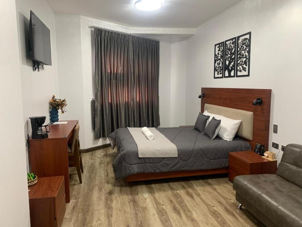 Postel nebo postele na pokoji v ubytování Hotel Sacha Golden