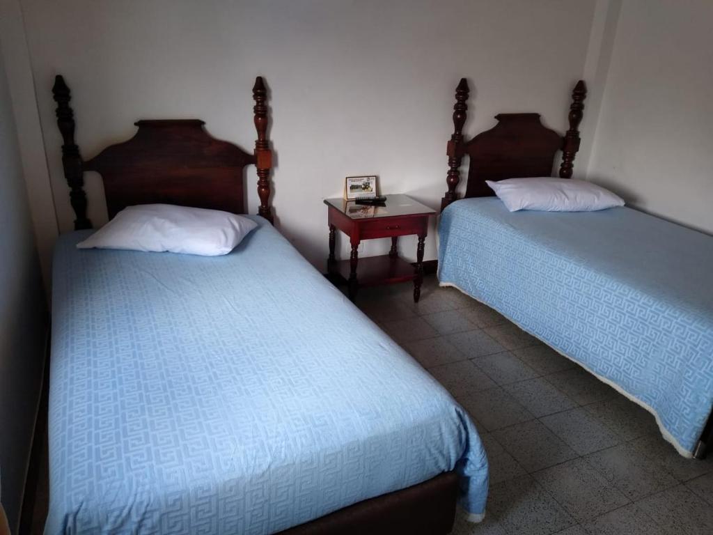 Postel nebo postele na pokoji v ubytování Hotel Tahami