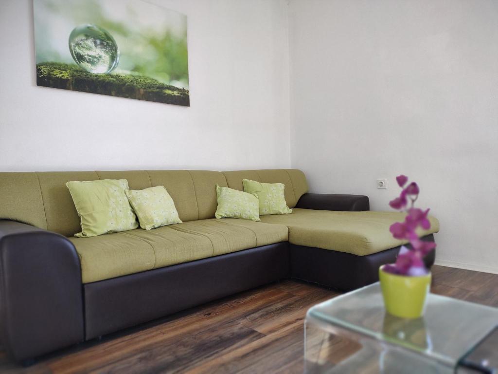 a living room with a couch and a table at Viridis in Rijeka