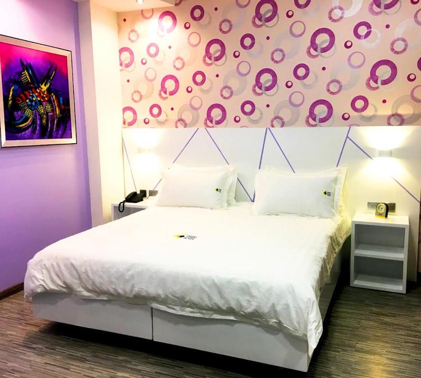 Postel nebo postele na pokoji v ubytování Luma Plaza Hotel