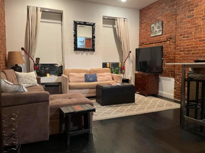 a living room with two couches and a tv at Fab 3 Bedroom 1Bath Apartment in NYC! in New York