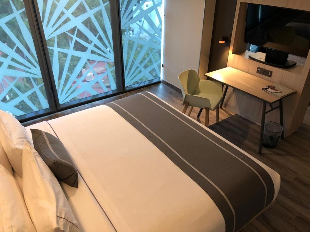 Postel nebo postele na pokoji v ubytování City Express Plus by Marriott Merida