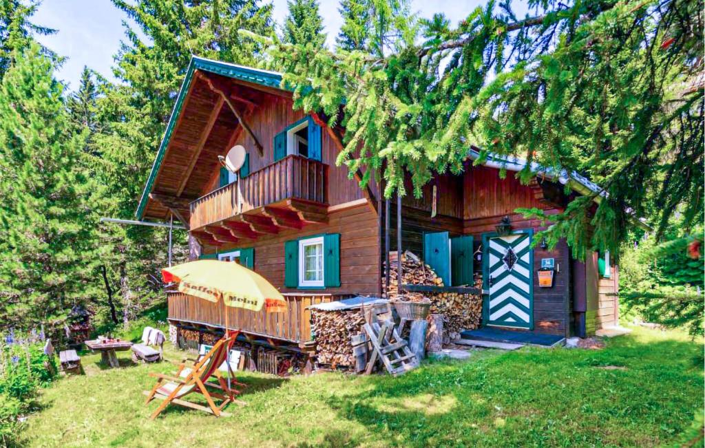 a log cabin with a porch and a balcony at 4 Bedroom Beautiful Home In Lienz in Lienz