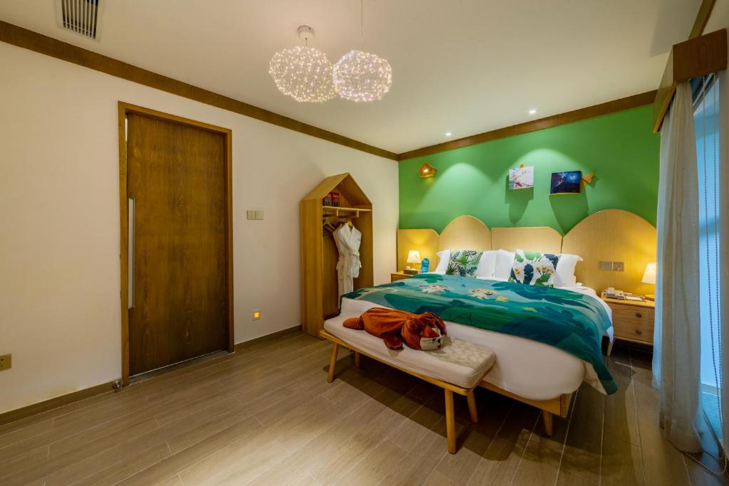 Postel nebo postele na pokoji v ubytování Little Hakka Hotel