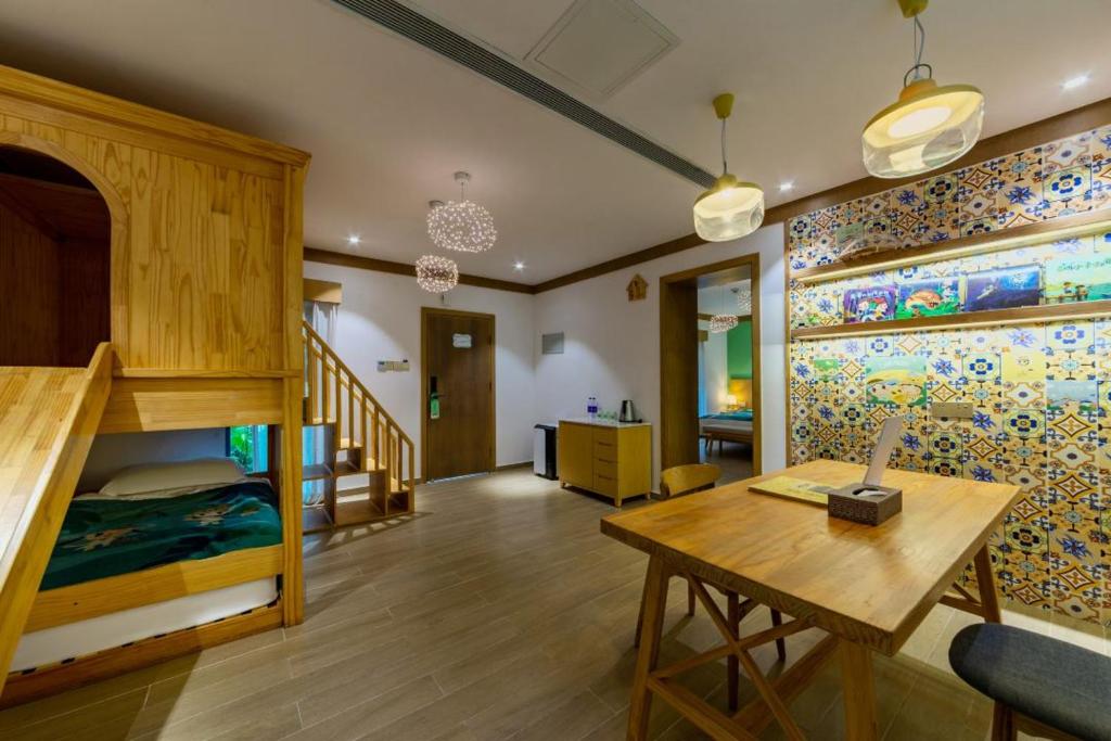 Postel nebo postele na pokoji v ubytování Little Hakka Hotel