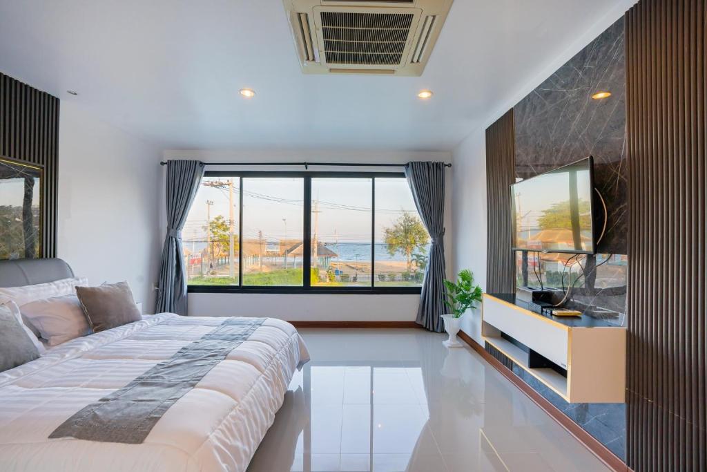 Ένα ή περισσότερα κρεβάτια σε δωμάτιο στο Anda Sea View Pranburi