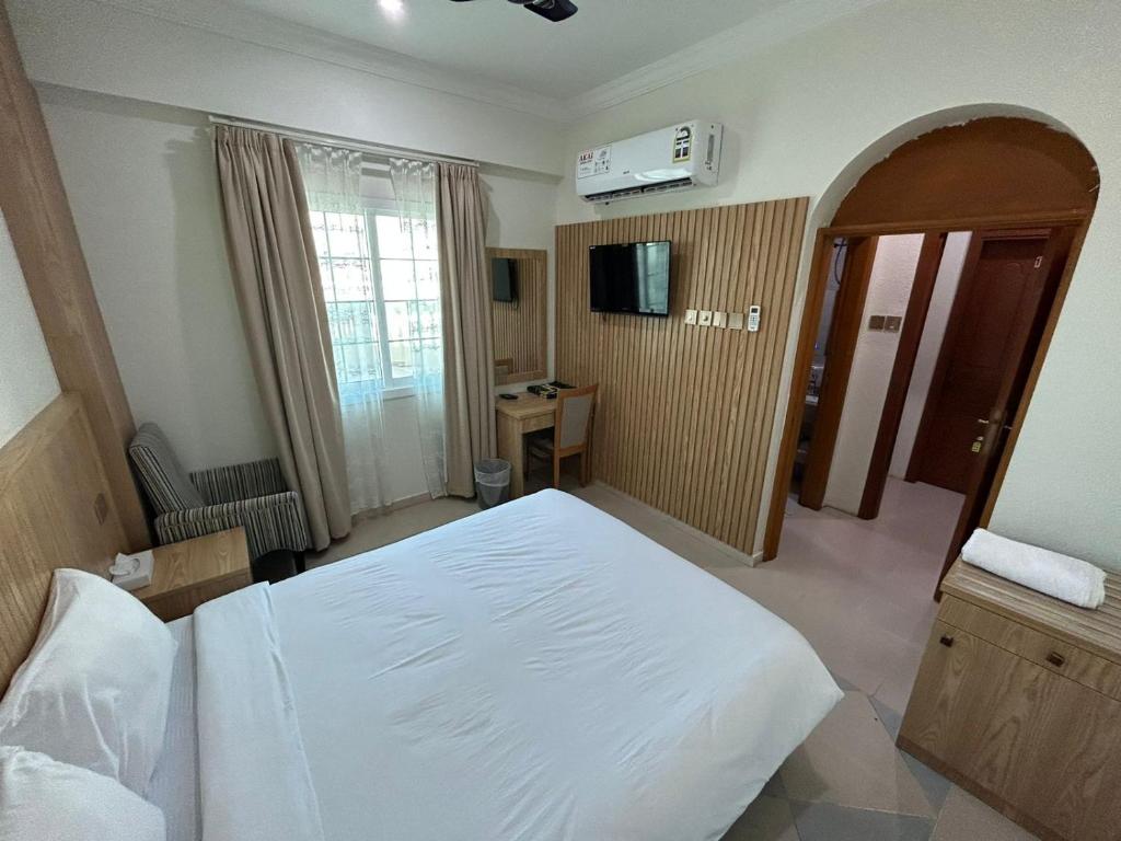 Postel nebo postele na pokoji v ubytování Safari Hotel