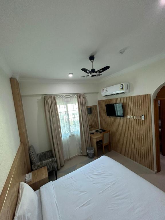 Postel nebo postele na pokoji v ubytování Safari Hotel