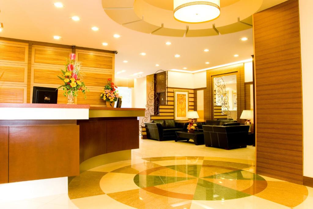 a lobby with a reception desk in a building at Celyn Hotel City Mall in Kota Kinabalu