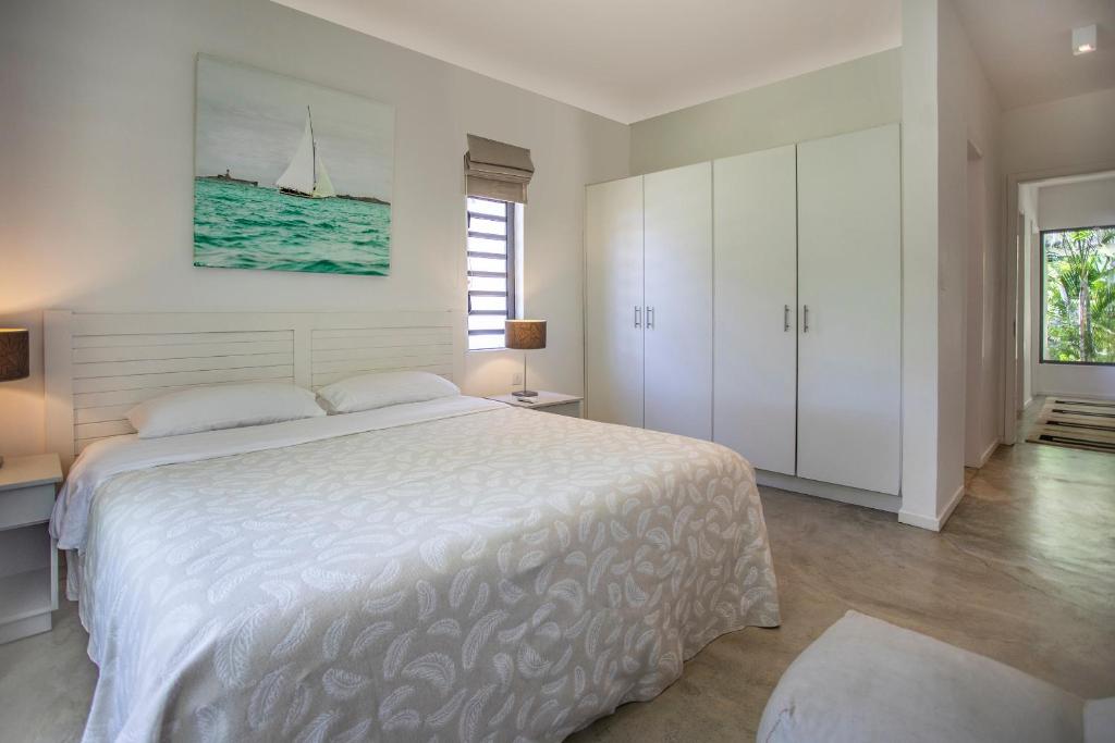 Postel nebo postele na pokoji v ubytování Beach Villa Poema