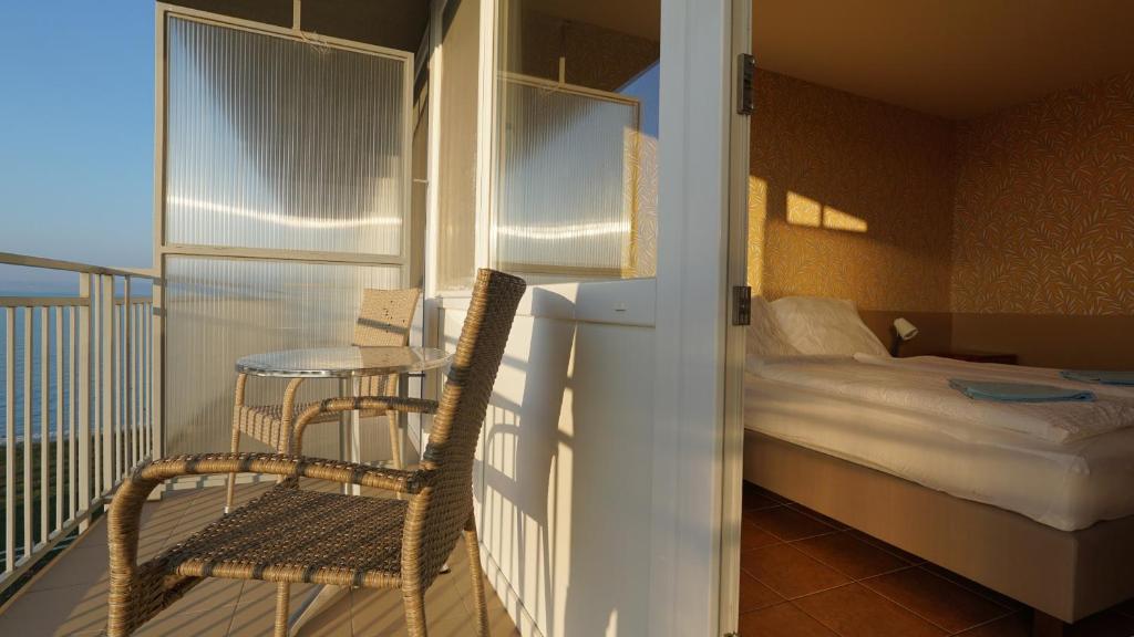 Postel nebo postele na pokoji v ubytování Plazs Hotel Siófok
