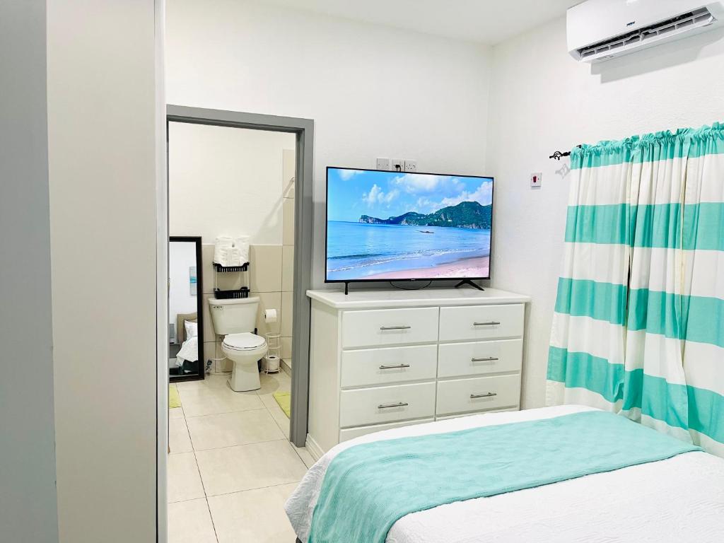 Postel nebo postele na pokoji v ubytování SALT ST LUCIA