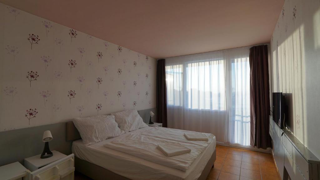 Postel nebo postele na pokoji v ubytování Plazs Hotel Siófok