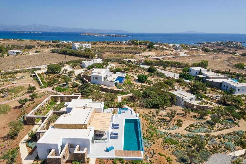 an aerial view of a villa with a swimming pool at ELEONAS Paros estate - villas with private pools OR jacuzzi & professional tennis court in Kampos Paros