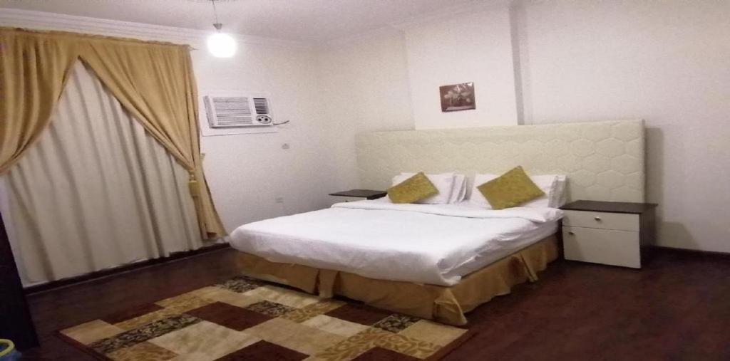 Postel nebo postele na pokoji v ubytování حياة ريف للوحدات السكنية المفروشة