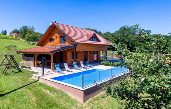 a house with a swimming pool in front of it at Visija in Sveti Martin na Muri