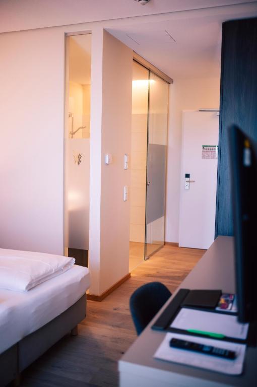 Postel nebo postele na pokoji v ubytování Hotel Calamus - 4 Sterne Superior
