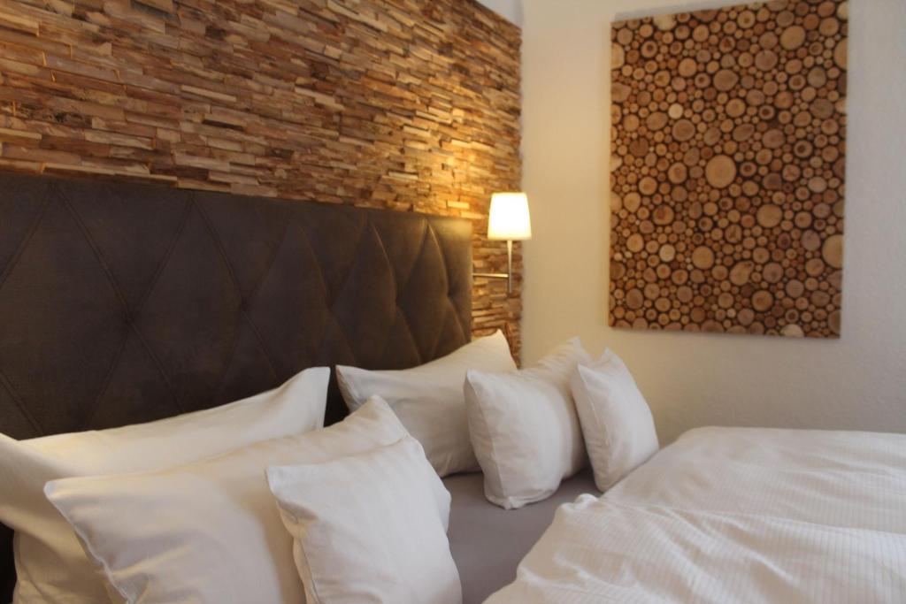Postel nebo postele na pokoji v ubytování Hotel Almrausch
