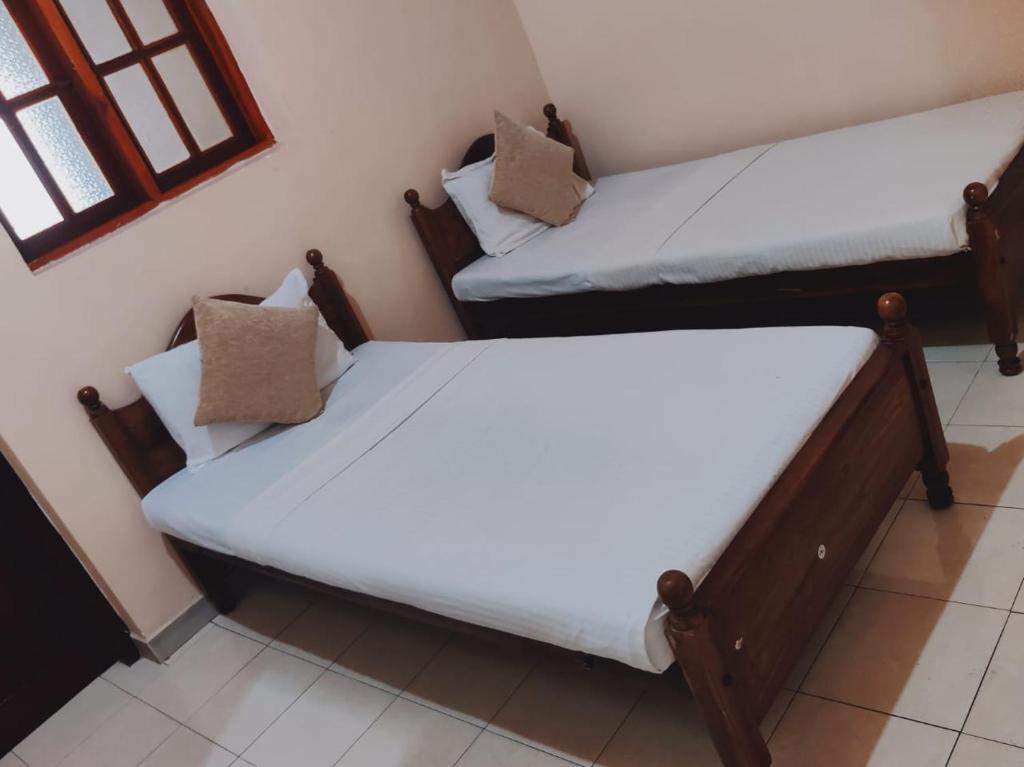 Postel nebo postele na pokoji v ubytování Grand Colonial Viveka