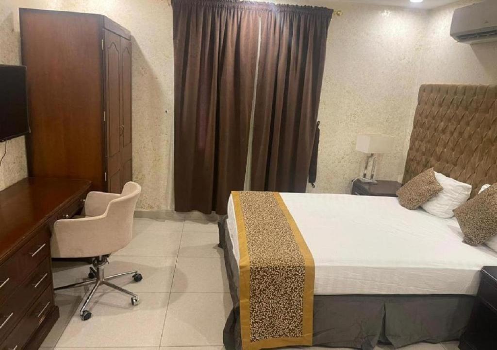 Postel nebo postele na pokoji v ubytování حياة ريف للوحدات السكنية المفروشة