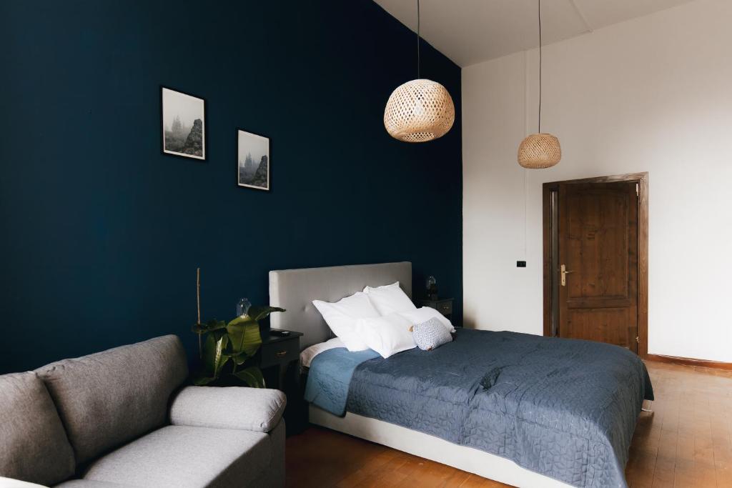 Ένα ή περισσότερα κρεβάτια σε δωμάτιο στο Central Blue Charm