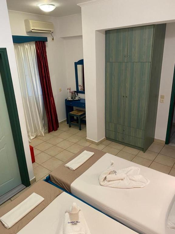 Postel nebo postele na pokoji v ubytování Golden Star