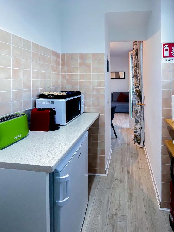A kitchen or kitchenette at La Terrazza Imperiale