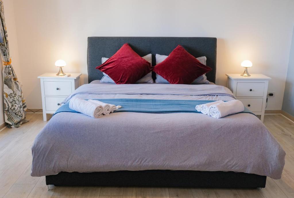 A bed or beds in a room at La Terrazza Imperiale