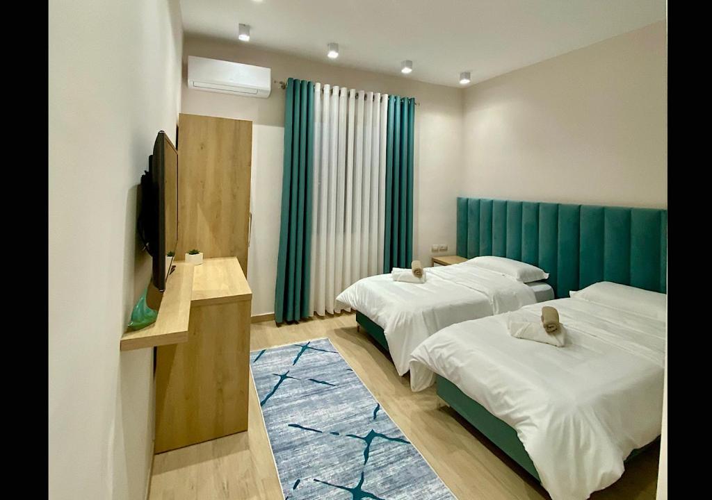 Hotel Krial tesisinde bir odada yatak veya yataklar