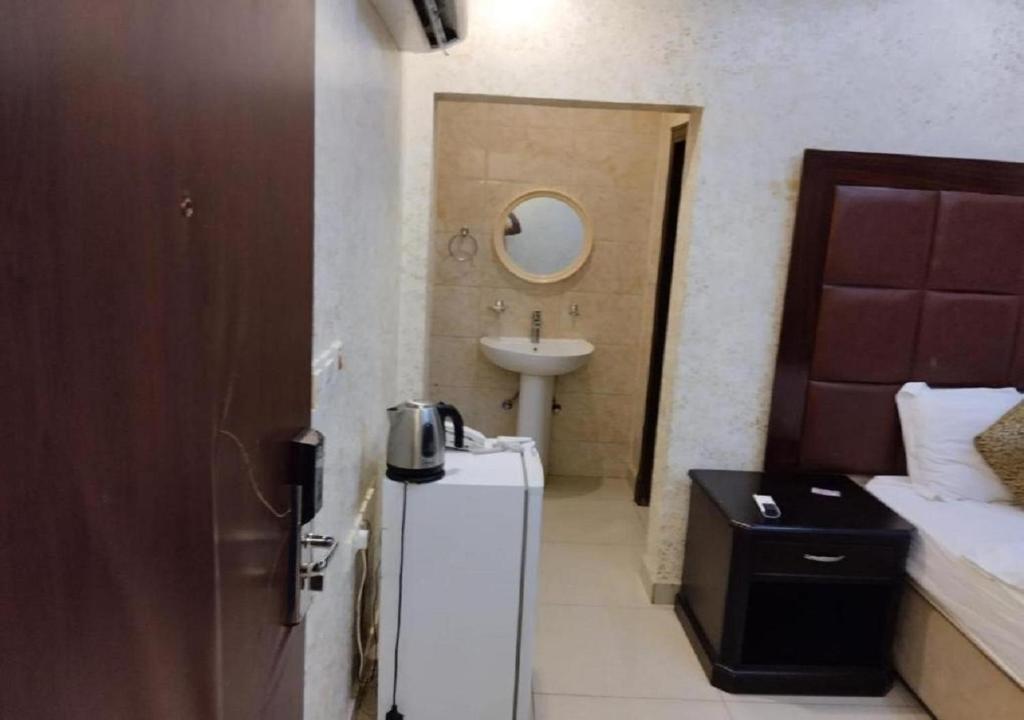 Postel nebo postele na pokoji v ubytování حياة ريف للوحدات السكنية المفروشة
