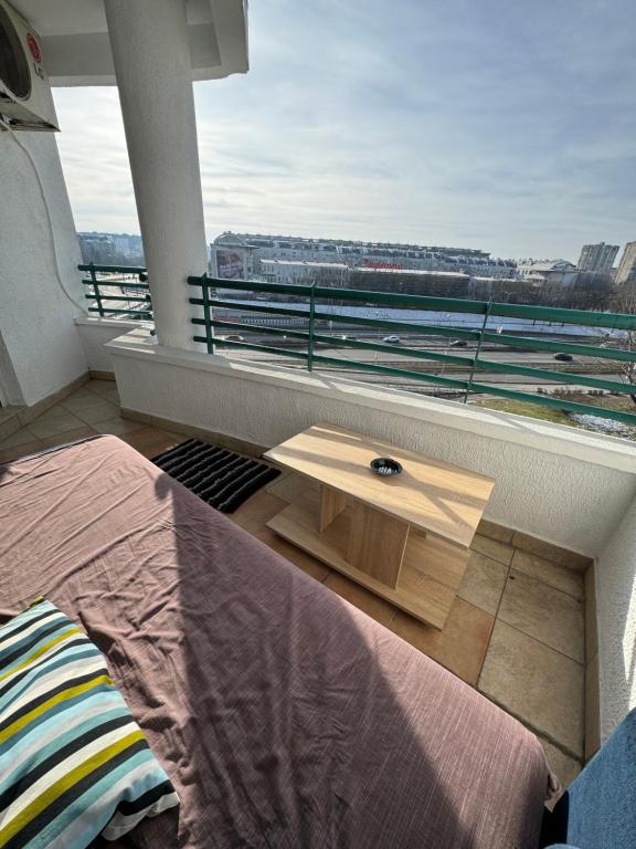 a bedroom with a bed and a window with a view at Arena Mila in Novi Beograd