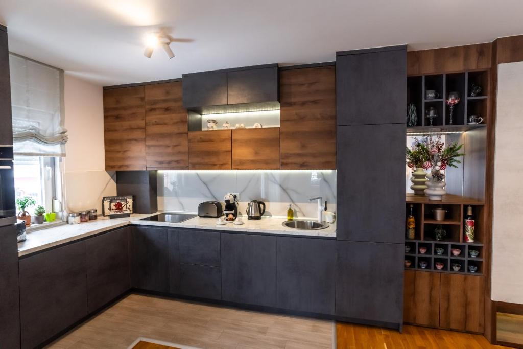 Kuchyň nebo kuchyňský kout v ubytování Apartman AuRa