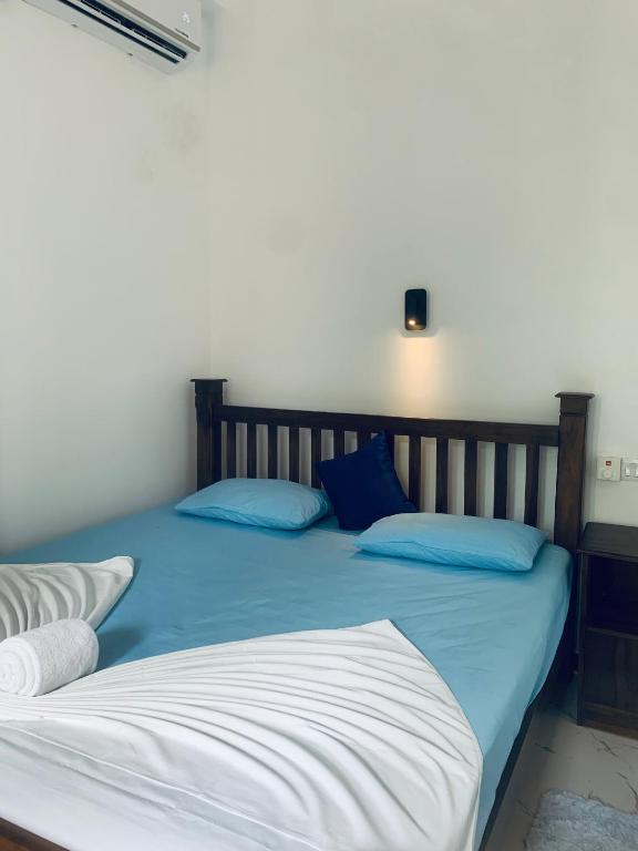 Postel nebo postele na pokoji v ubytování Center Point Villa Unawatuna