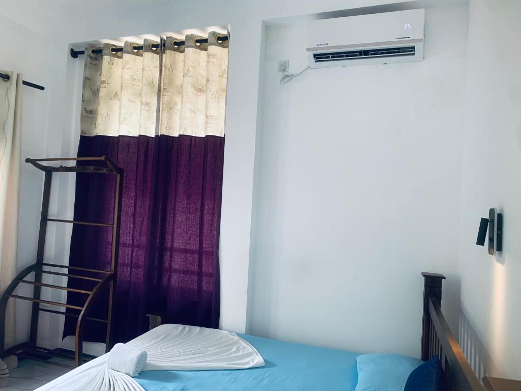 Postel nebo postele na pokoji v ubytování Center Point Villa Unawatuna