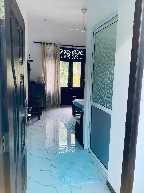 Postel nebo postele na pokoji v ubytování Center Point Villa Unawatuna