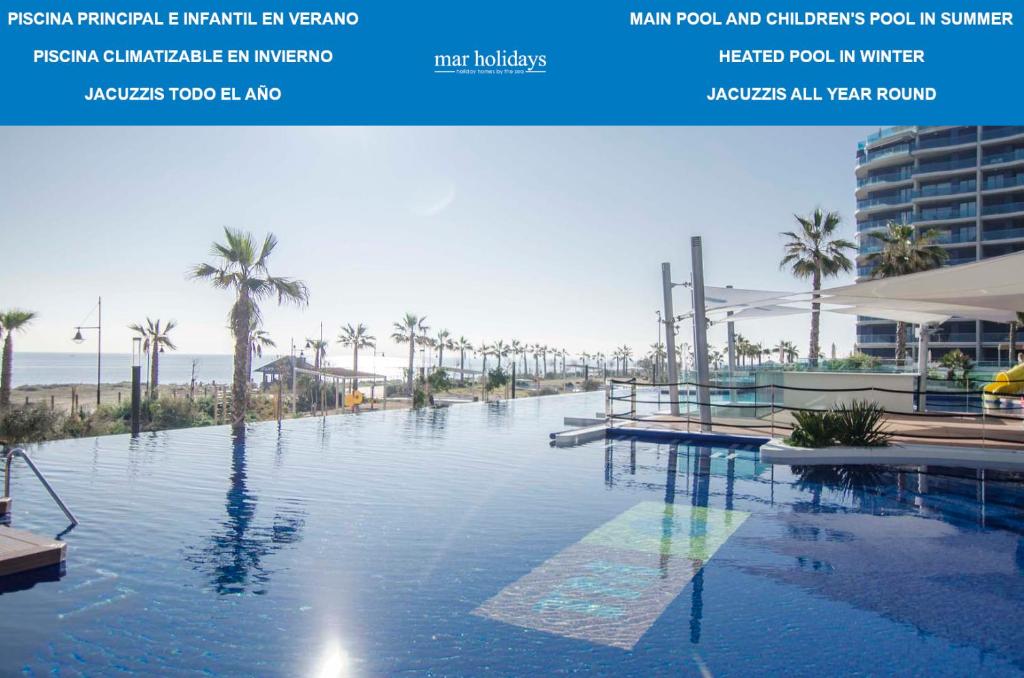 a view of a swimming pool at a resort at Sea Senses by Mar Holidays in Torrevieja