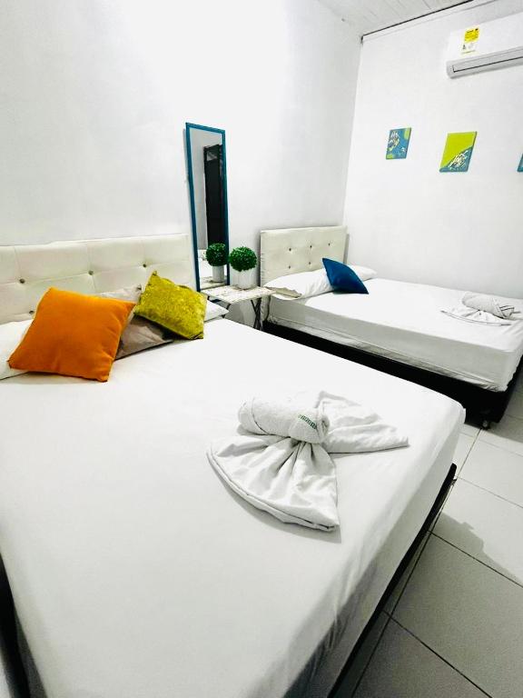 מיטה או מיטות בחדר ב-Riviera Central Hotel