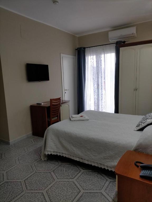 Postel nebo postele na pokoji v ubytování Leon D'Oro