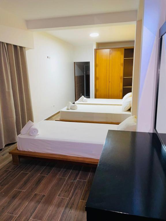 Postel nebo postele na pokoji v ubytování Residencial Sol Point Art