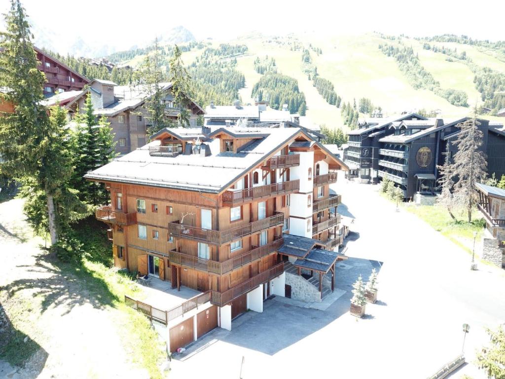 an aerial view of a building in a mountain at Résidence Les Sapins - Courchevel 1850 in Courchevel
