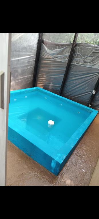 a blue table with a ball on top of it at Toby in Sierra de los Padres