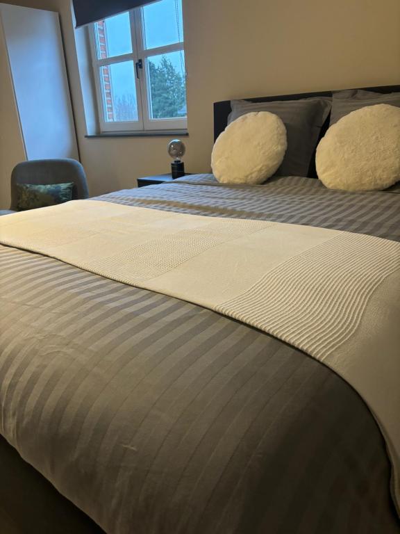 Postel nebo postele na pokoji v ubytování De Kempische Akker