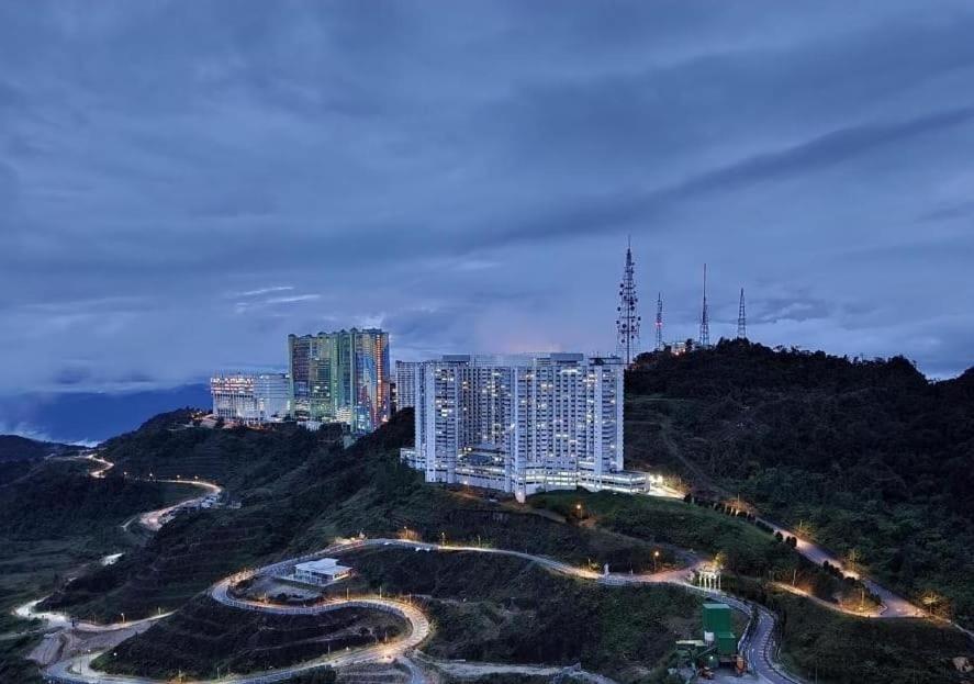 a view of a city at night with buildings at Golden Hill Resort Genting Highland in Genting Highlands