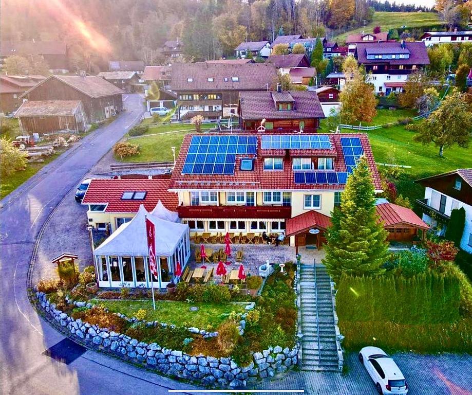a house with solar panels on top of it at Hotel JMS Holiday Allgäu in Oberreute