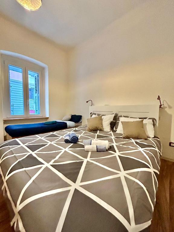 a bedroom with a large bed in a room at RESIDENCE ZAR 4 in Trieste